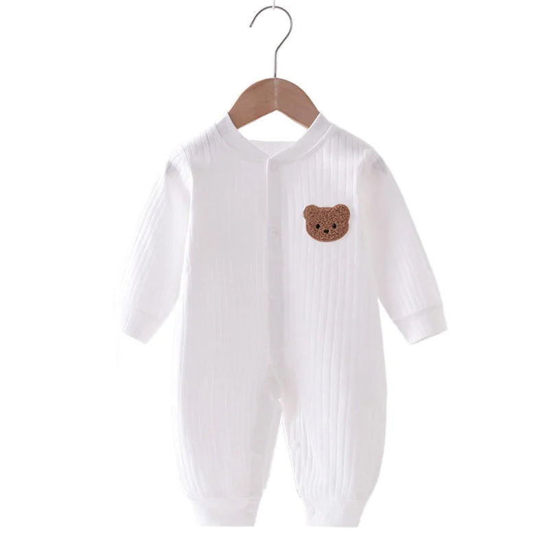 White baby boy romper made from breathable cotton, perfect for cool weather and newborn comfort.